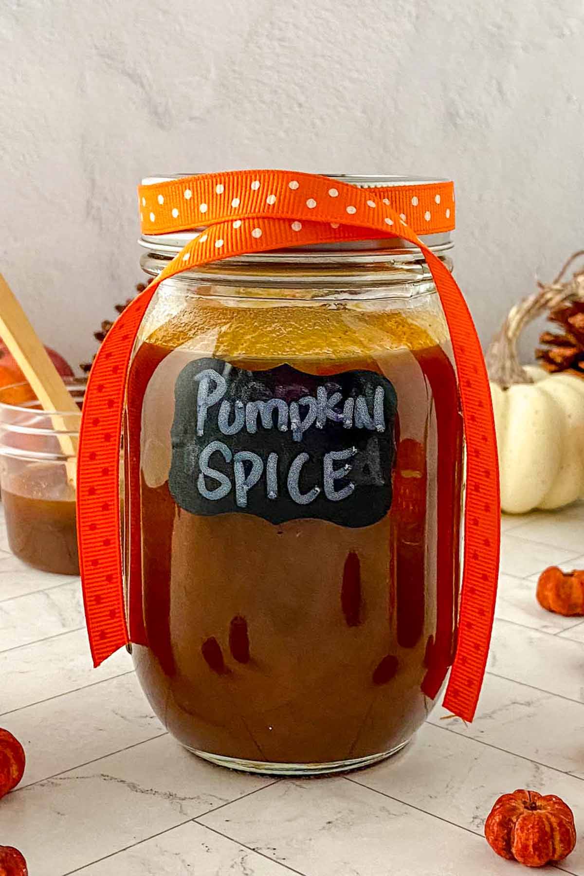 homemade pumpkin spice syrup in a glass.
