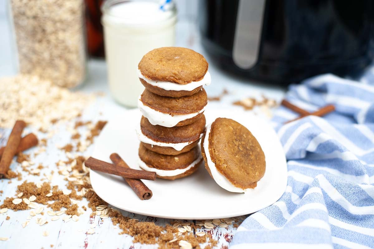 stacked oatmeal creme pies on a plate.
