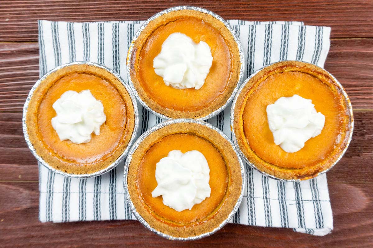top view of mini pumpkin pies on a table.