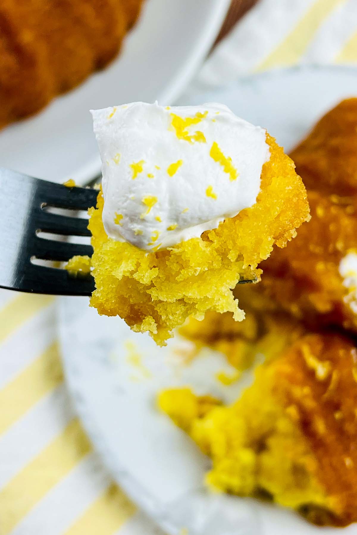 piece of lemon cake on a fork.
