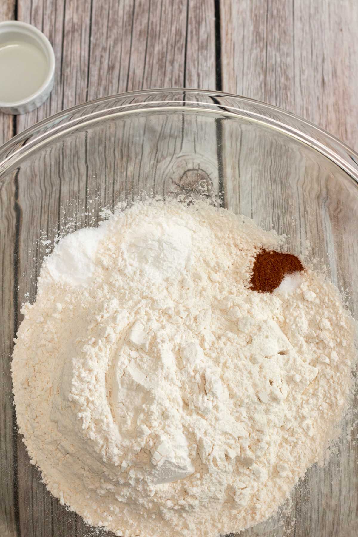 Cinnamon, baking soda, salt and baking powder in a mixing bowl.