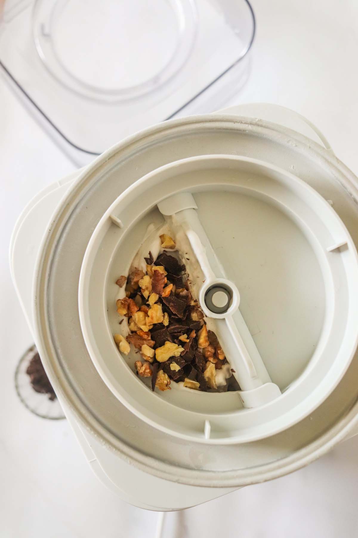 Chocolate and nuts in the ice cream maker.