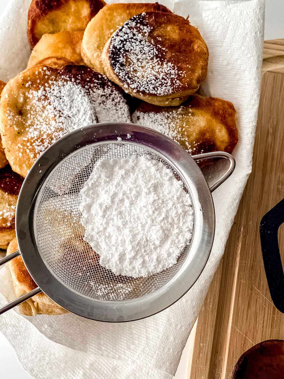 Powdered sugar over the fried biscuits.