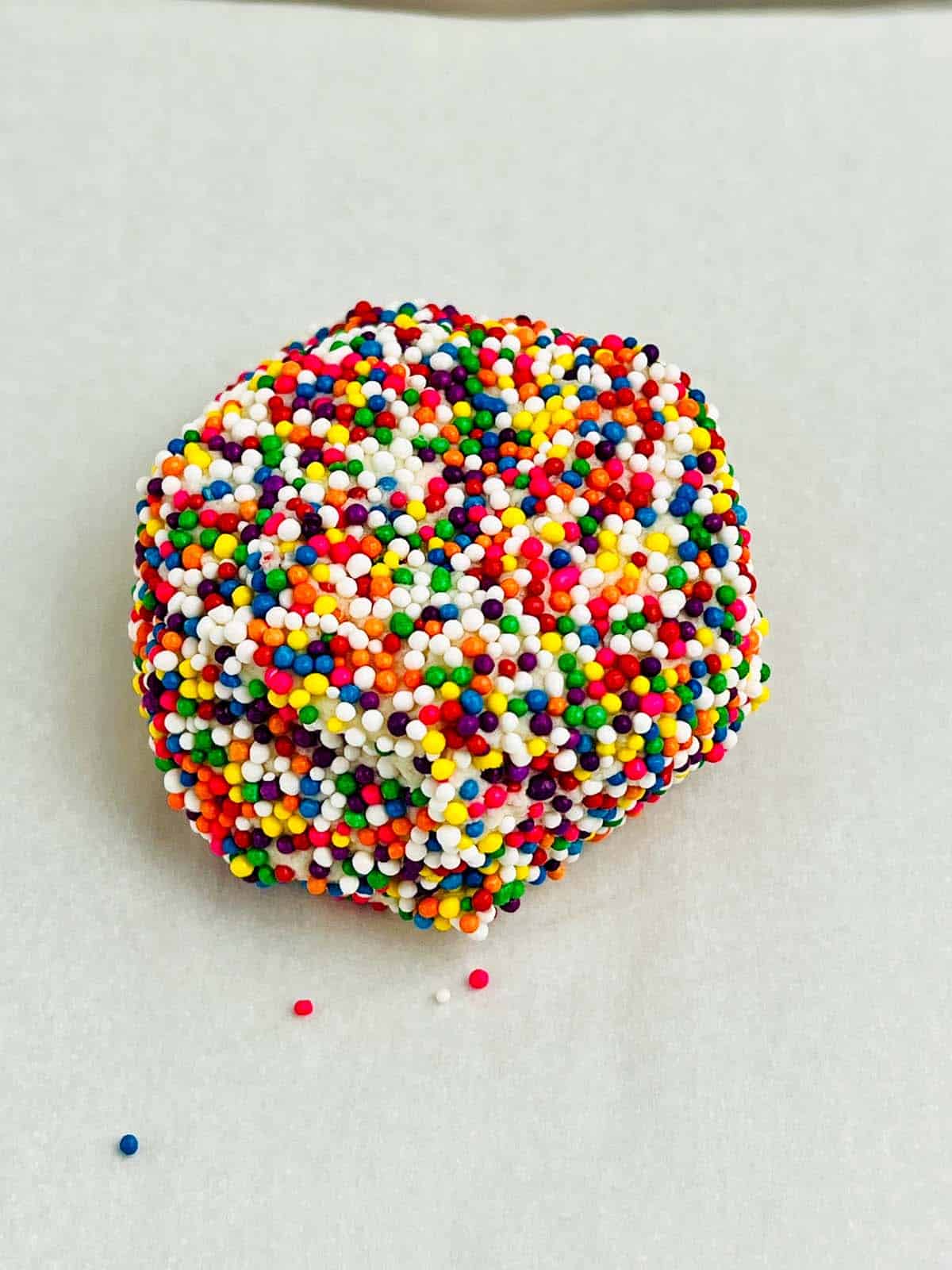 Cookie dough covered in sprinkles.