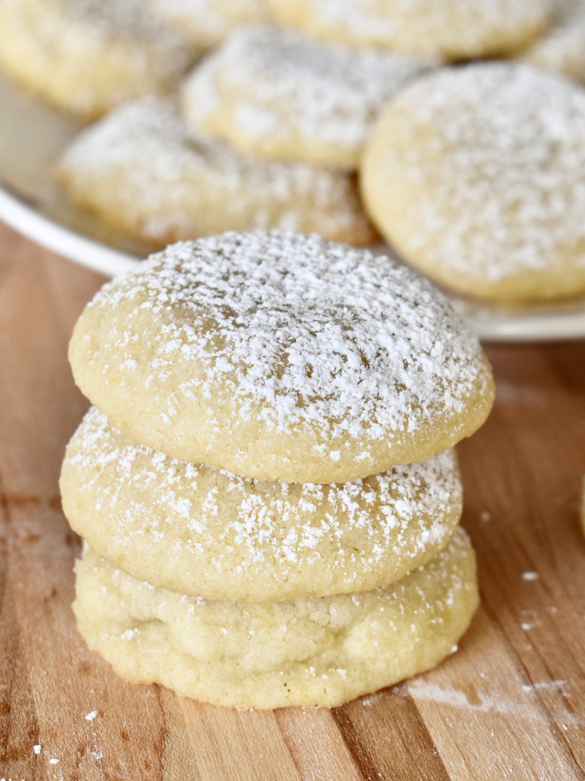 Lemon Shortbread Cookies stacked on a countertop. 