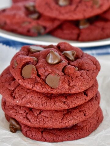 Red Velvet Cake Mix Cookies with chocolate chips on parchment paper.