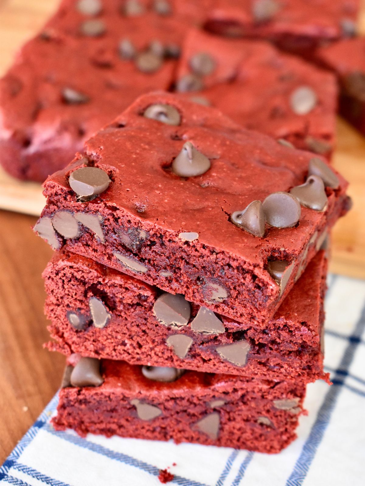 Red Velvet Cake Mix Brownies with Chocolate Chips stacked on each other. 