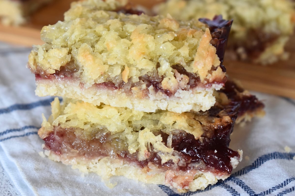Raspberry Coconut Bars stacked on each other.