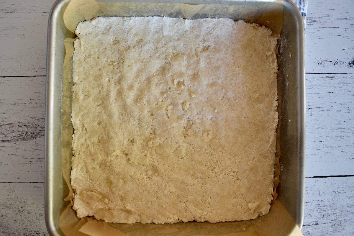 Shortbread pressed into baking pan.