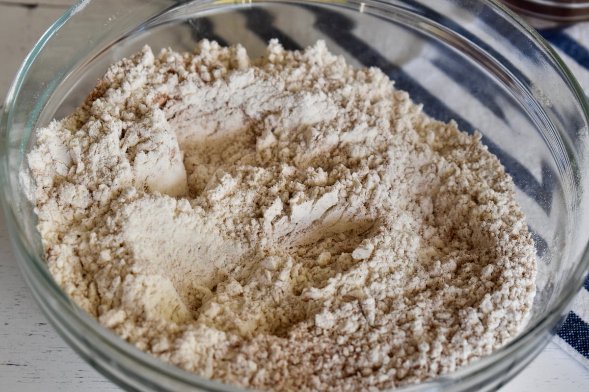 Dry ingredients mixed together in a glass bowl.